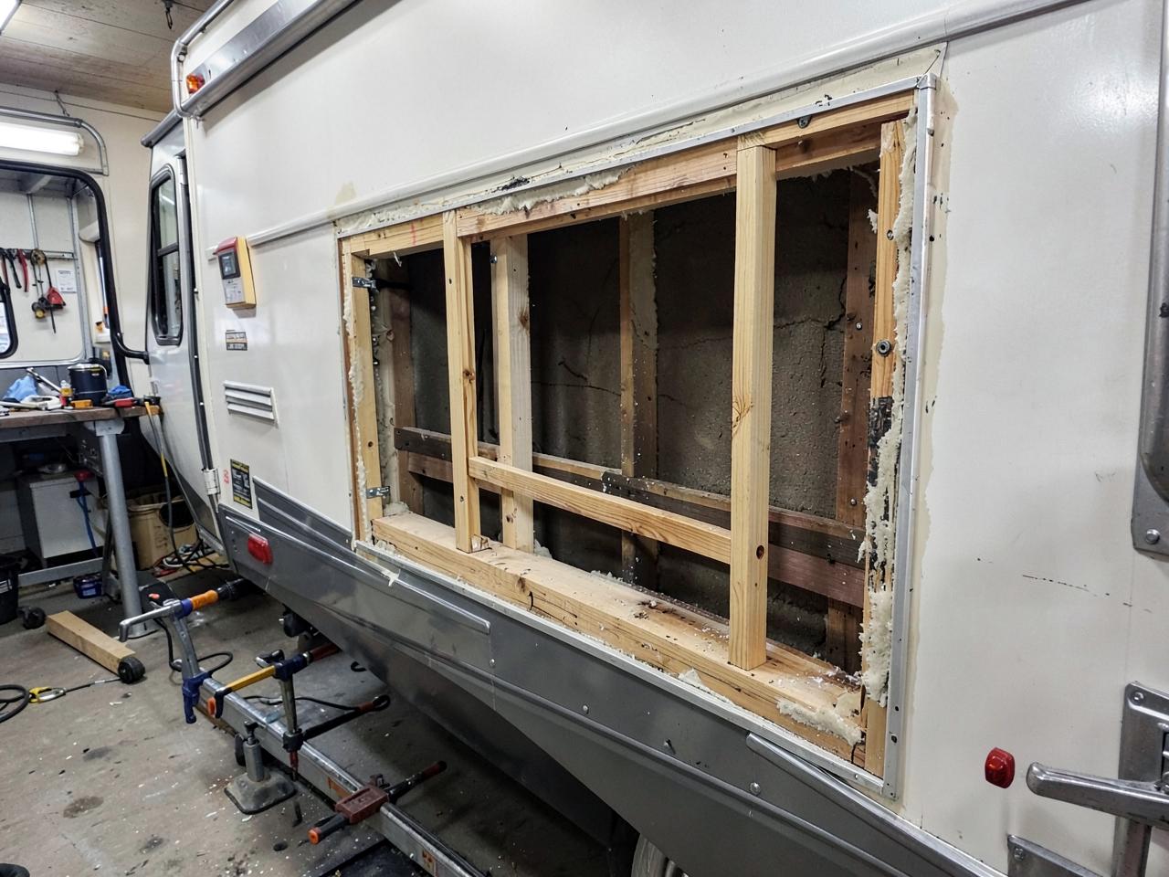 RV sidewall opened up with framing being rebuilt after water damage